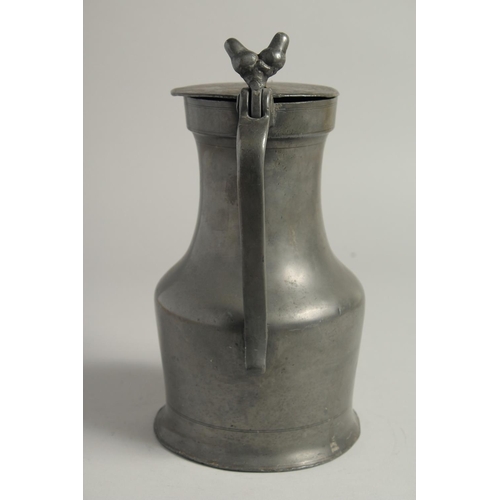 1334 - AN 18TH CENTURY FRENCH PEWTER JUG AND COVER. 10ins high.