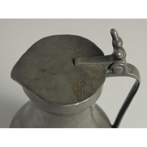 1334 - AN 18TH CENTURY FRENCH PEWTER JUG AND COVER. 10ins high.