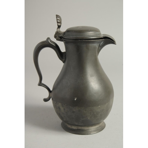 1335 - A LARGE 18TH CENTURY PEWTER JUG AND COVER. 10ins high.