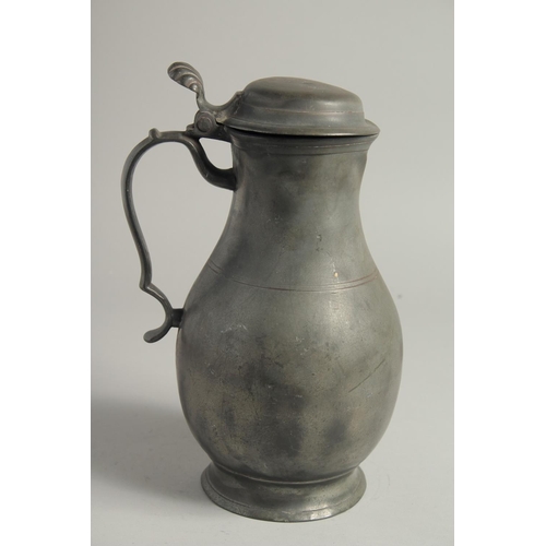 1336 - AN 18TH CENTURY PEWTER FLEMISH PEWTER FLAGON AND COVER. 11ins high.