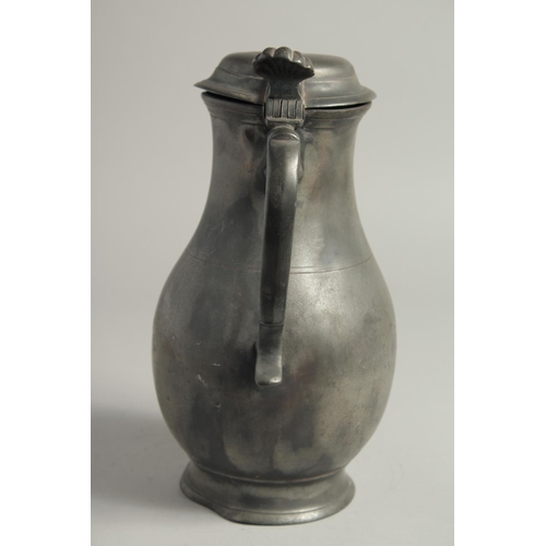 1336 - AN 18TH CENTURY PEWTER FLEMISH PEWTER FLAGON AND COVER. 11ins high.