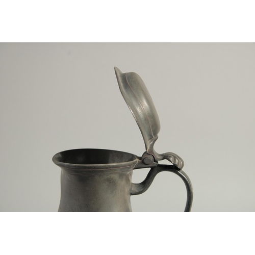 1336 - AN 18TH CENTURY PEWTER FLEMISH PEWTER FLAGON AND COVER. 11ins high.