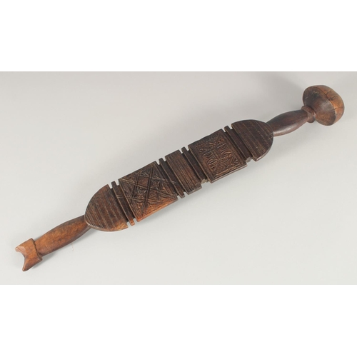 1341 - A SOUTH SEAS CARVED CLUB OR PADDLE. 2ft 3ins long.