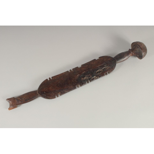 1341 - A SOUTH SEAS CARVED CLUB OR PADDLE. 2ft 3ins long.