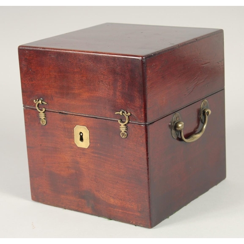 1345 - A GOOD GEORGIAN SQUARE MAHOGANY DECANTER BOX AND COVER with brass carrying handle and filled with fo... 