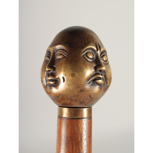 1372 - A FOUR-FACED BUDDHA'S HEAD WALKING STICK 3ft long