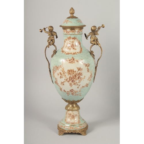 1383 - A GOOD PAIR OF FRENCH STYLE PORCELAIN AND METAL URNS AND COVERS with cupid handles. 1ft 8ins high.... 