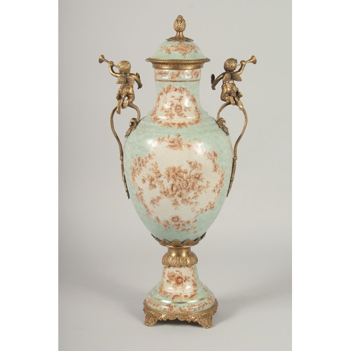 1383 - A GOOD PAIR OF FRENCH STYLE PORCELAIN AND METAL URNS AND COVERS with cupid handles. 1ft 8ins high.... 