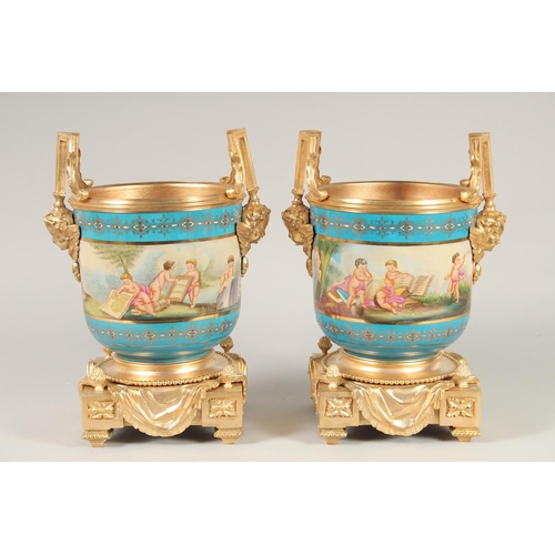 1390 - A GOOD PAIR OF SEVRES STYLE PORCELAIN AND GILT METAL CACHE POTS. 1ft 1ins high.