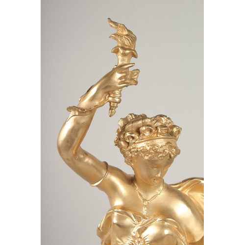 1391 - A GOOD GILT METAL GROUP OF A CLASSICAL YOUNG LADY and two cupids, on a circular marble base. Signed.... 