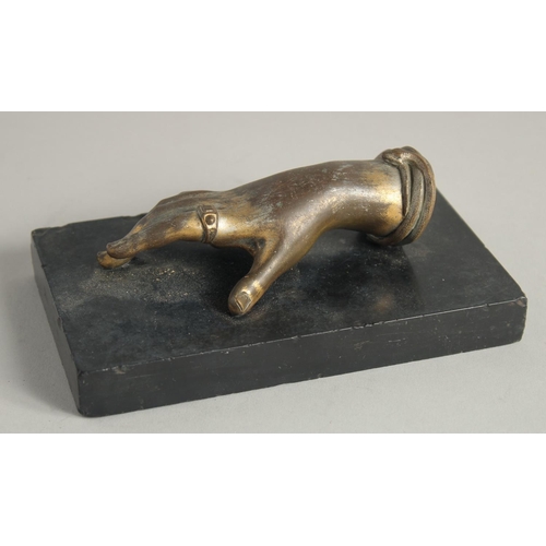 1398 - AN ITALIAN BRONZE HAND. 5ins long on a black marble base.