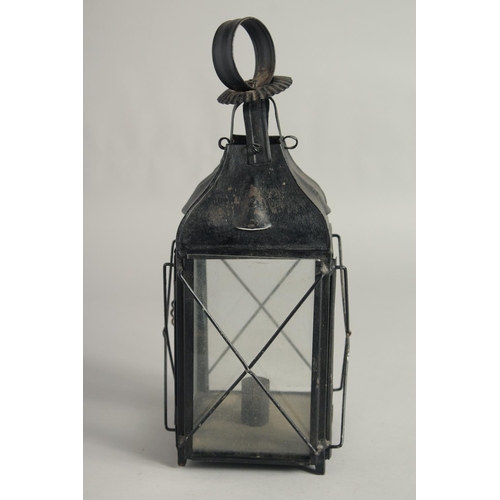 1402 - AN OLD BLACK PAINTED TIN LANTERN. 13ins high.