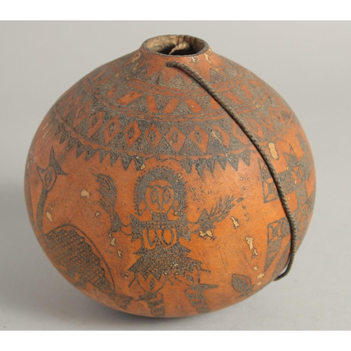 1404 - A GOOD TRIBAL DECORATED GOURD. 6ins.