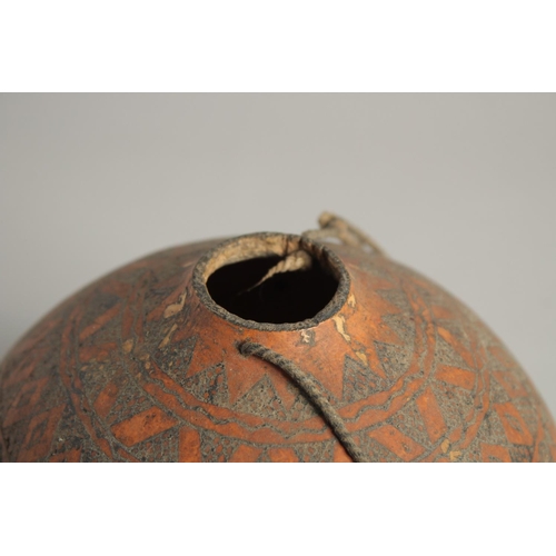 1404 - A GOOD TRIBAL DECORATED GOURD. 6ins.