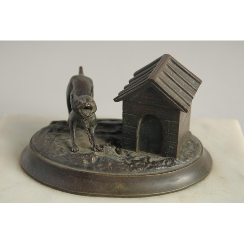 1410 - A BRONZED OVAL INKSTAND with a dog, on a marble base. 6.5ins