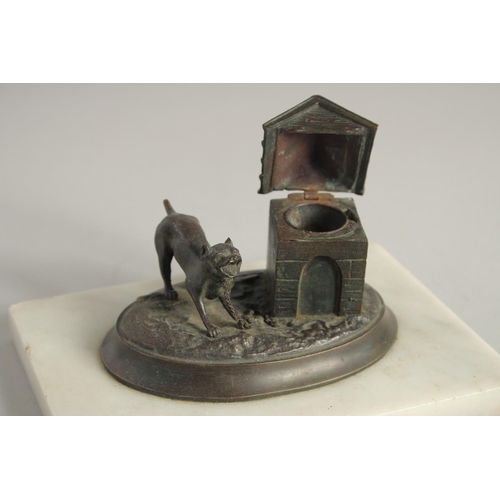 1410 - A BRONZED OVAL INKSTAND with a dog, on a marble base. 6.5ins