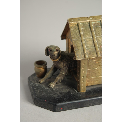 1411 - A BRONZE INKWELL, DOG IN A KENNEL on a marble base. 5ins long.