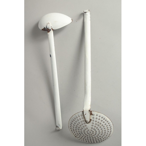 1420 - A BLUE AND WHITE TIN SKIMMER AND LADLE on a stand. 17ins long