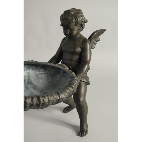 1424 - A GOOD 19TH CENTURY FRENCH SPELTER CENTREPIECE, a bowl held up by two cherubs.
16ins long.