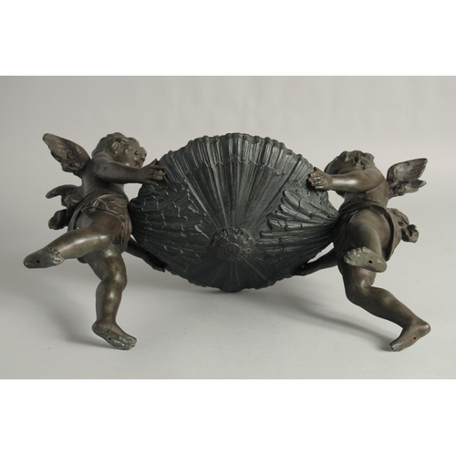 1424 - A GOOD 19TH CENTURY FRENCH SPELTER CENTREPIECE, a bowl held up by two cherubs.
16ins long.