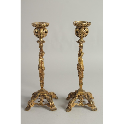 1425 - A GOOD PAIR OF ORMOLU CANDLESTICKS, ROCOCCO with classical female figure. 12ins high.