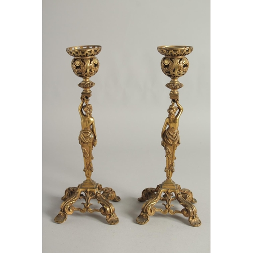 1425 - A GOOD PAIR OF ORMOLU CANDLESTICKS, ROCOCCO with classical female figure. 12ins high.