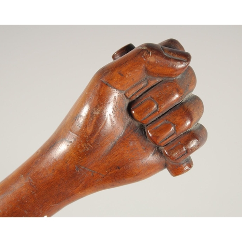 1433 - A FOLK ART WALKING STICK, 'Clenched Fist'. 36ins long.