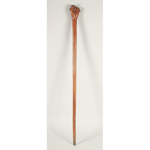 1433 - A FOLK ART WALKING STICK, 'Clenched Fist'. 36ins long.