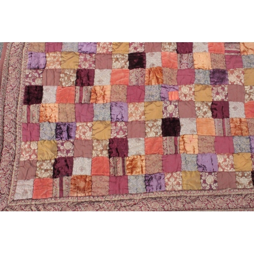 1441 - A LARGE PATCHWORK QUILT.