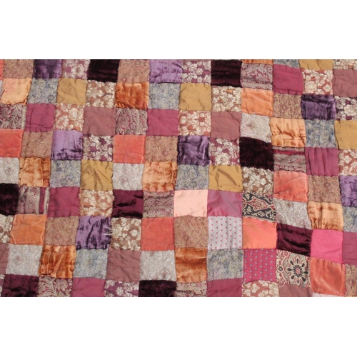 1441 - A LARGE PATCHWORK QUILT.