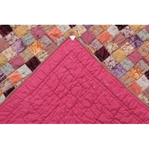 1441 - A LARGE PATCHWORK QUILT.