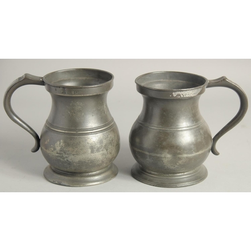 1447 - TWO PEWTER QUART TANKARDS 6ins high.