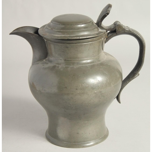 1448 - AN EARLY PEWTER ALE JUG AND COVER. 9ins high.