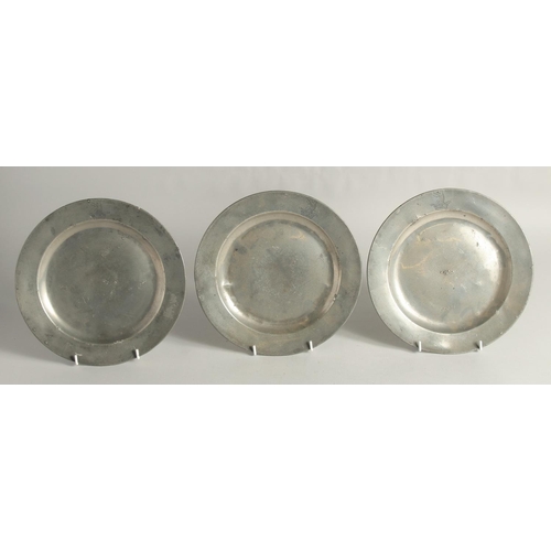 1452 - THREE EARLY PEWTER PLATES, Griffin Crown Crest. 9.5ins diameter.