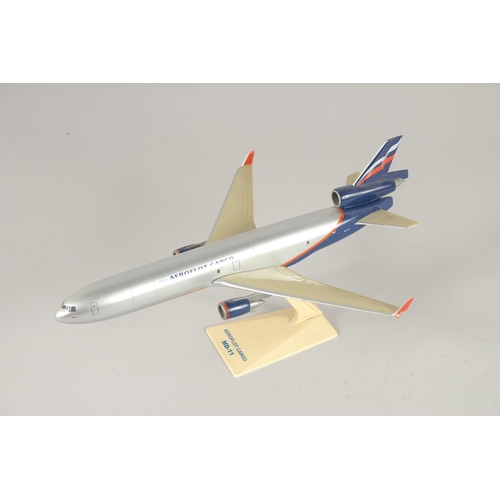 1460 - A COLLECTION OF EIGHT PLASTIC AND METAL AEROPLANES.