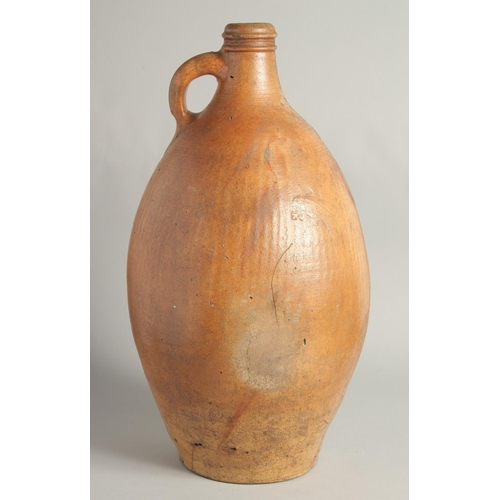 1462 - A VERY LARGE EARLY STONEWARE FLAGON. 18in high.