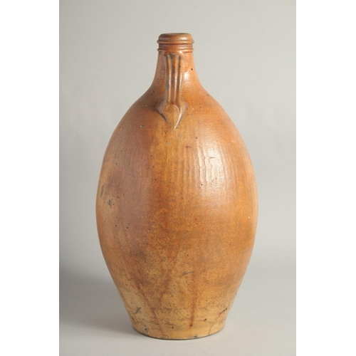 1462 - A VERY LARGE EARLY STONEWARE FLAGON. 18in high.