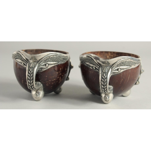 1464 - A PAIR OF SILVER MOUNTED COCONUT CUPS 4ins