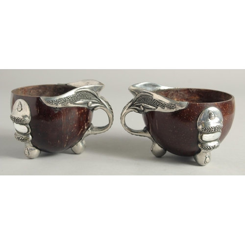 1464 - A PAIR OF SILVER MOUNTED COCONUT CUPS 4ins