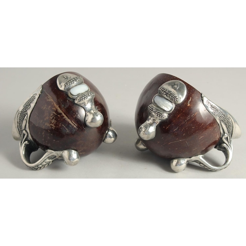 1464 - A PAIR OF SILVER MOUNTED COCONUT CUPS 4ins