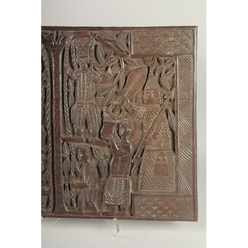 1466 - A WELL CARVED BENIN WOOD PANEL formed as two connecting panels of figures. 19ins & 26ins.