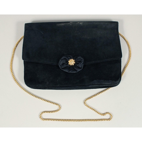 1481 - A BLACK VELVET EVENING BAG 6.5ins x 9.5ins with gilt stud.