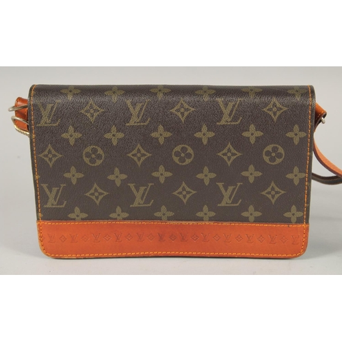 1483 - A LOUIS VUITTON LEATHER BAG in original box.