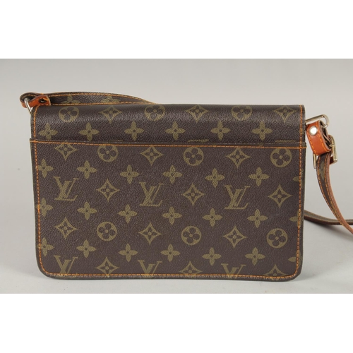 1483 - A LOUIS VUITTON LEATHER BAG in original box.