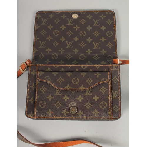 1483 - A LOUIS VUITTON LEATHER BAG in original box.