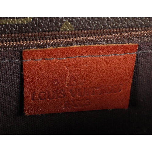 1483 - A LOUIS VUITTON LEATHER BAG in original box.