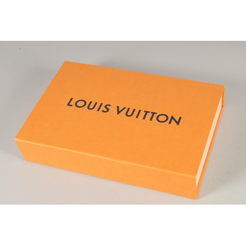 1483 - A LOUIS VUITTON LEATHER BAG in original box.