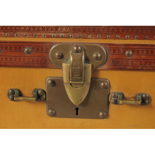 1497 - A LOUIS VUITTON SUITCASE. No. 736514. Plain leather with LV monogram banding. 25ins long x 15.5ins w... 