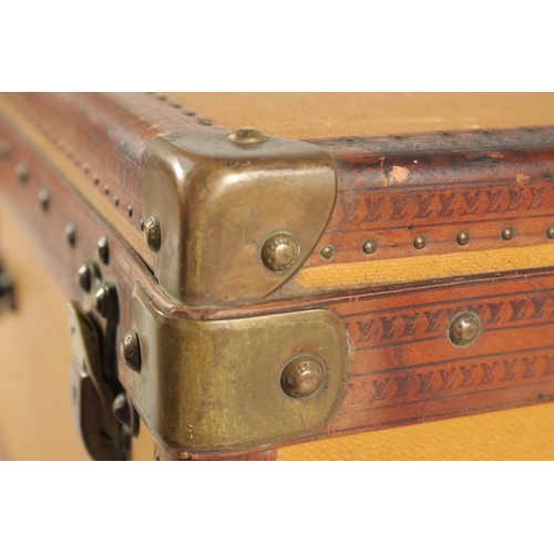 1497 - A LOUIS VUITTON SUITCASE. No. 736514. Plain leather with LV monogram banding. 25ins long x 15.5ins w... 