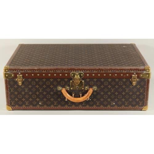 1498 - A LARGE LOUIS VUITTON SUITCASE. No. 1068754. With Louis Vuitton label. Lock no. 1262082. 31.5ins lon... 